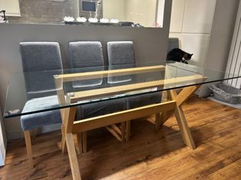 Glass Top Dining Table with Wooden Legs – Good Condition