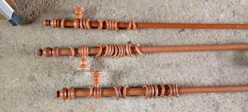 Three 7 foot long wooden curtain poles