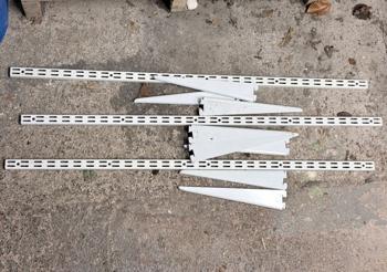 Slotting type shelving brackets and arm